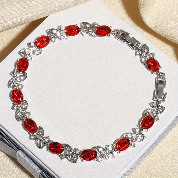 Pulseira com pedras prateadas e vermelhas
